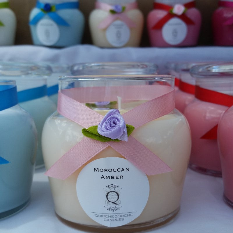 quirche zorche candles, scented candle, fragrant candle, wick, candle, glass jar candle, glass jar, one wick candle, candle fragrance, home fragrance, fragrance, décor, frangipani, white candle, white, peach colour candle, moroccan amber candle, moroccan amber fragrance